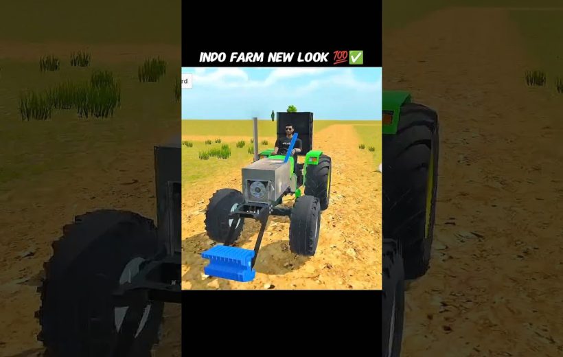 Man driving a modified tractor across a dry field with blue front attachment