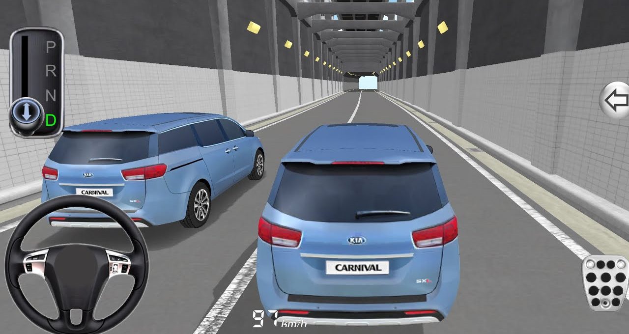 Two blue Kia Carnival minivans driving through a long lit tunnel, rear view visible