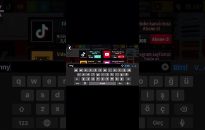 Tablet screen showing an on-screen keyboard typing "mny" with social media icons above