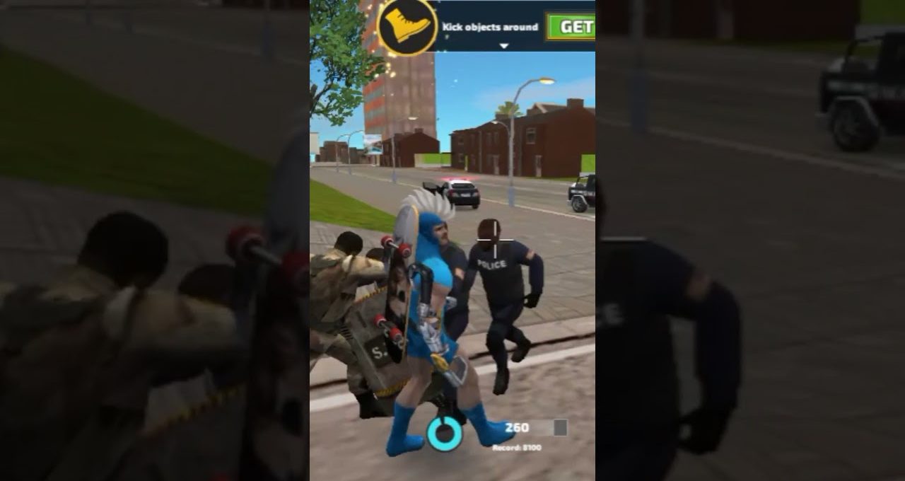 Video game character in blue costume fighting police officers on a city sidewalk