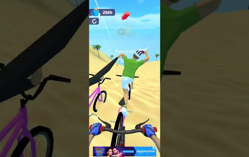 First-person view of biking behind a rider on sandy desert course with palm trees