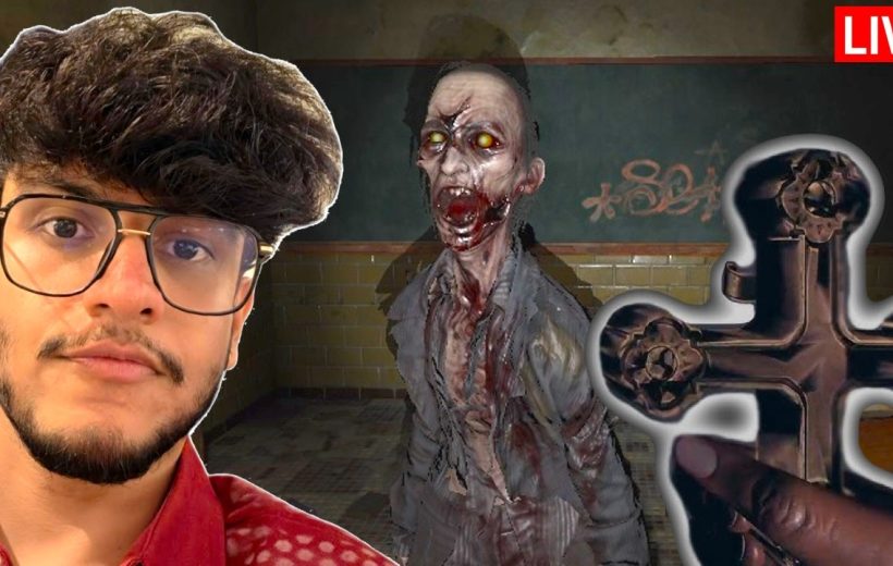 Young man beside a screaming zombie in a dim hallway with a hand holding a cross
