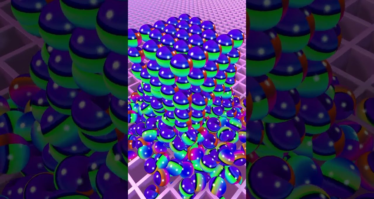 Stacked colorful glossy spheres forming a cube on a pink grid surface