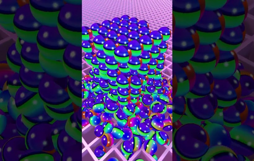Stacked colorful glossy spheres forming a cube on a pink grid surface