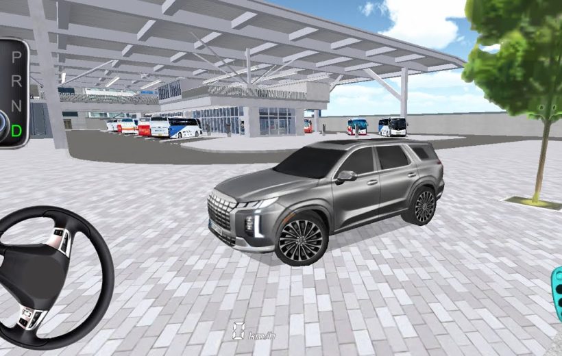 Silver SUV parked under a large covered bus terminal with buses in background
