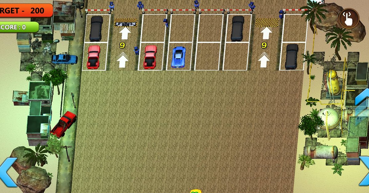 Top-down view of a parking lot with parked cars and surrounding industrial buildings