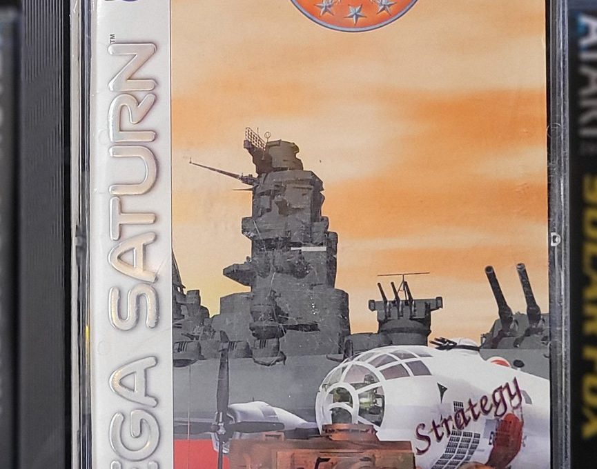 Sega Saturn game case for "Iron Storm" showing warship, plane, and tank artwork.