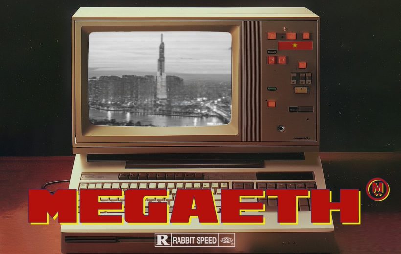 Vintage computer monitor showing black-and-white city skyline with bold "MEGAETH" title overlay
