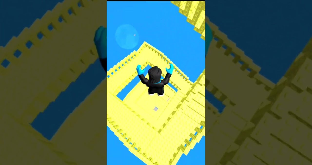 Avatar in black falling down a spiraling yellow block tower against blue sky