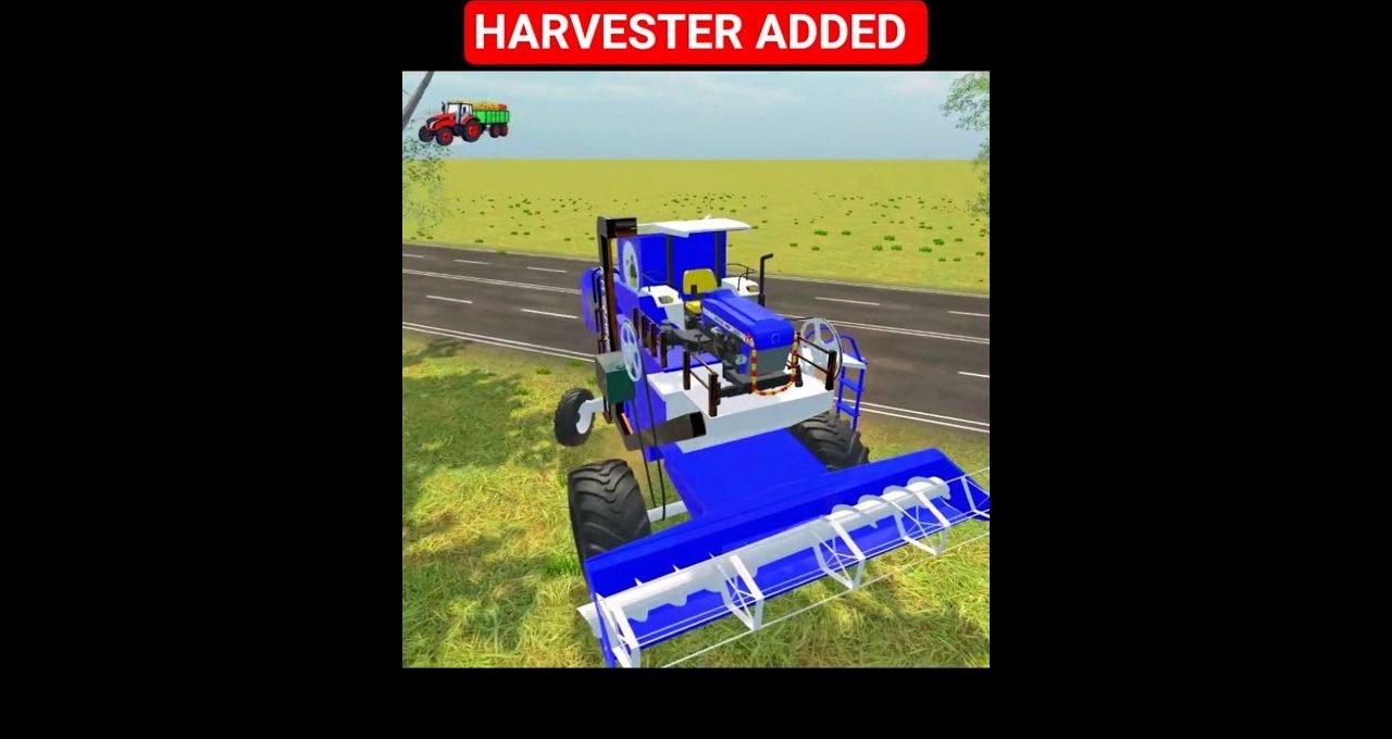 Blue combine harvester parked by roadside in a grassy field under clear sky
