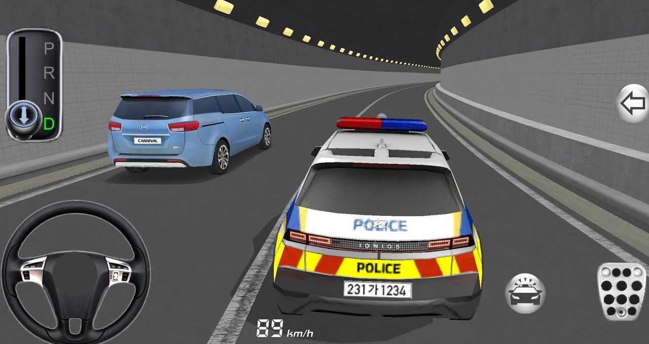 Police car with lights tailing a blue minivan inside a lit road tunnel