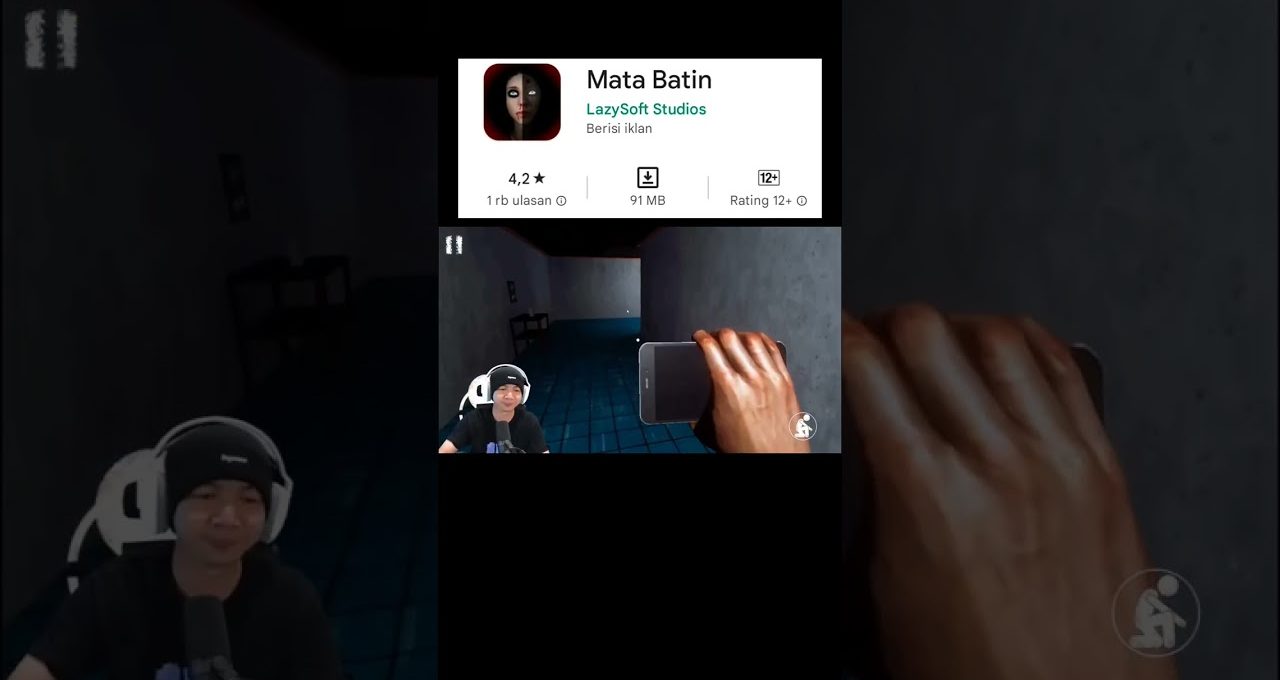 Gamer livestream holding phone while playing a first-person horror game in hallway