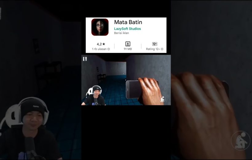 Gamer livestream holding phone while playing a first-person horror game in hallway