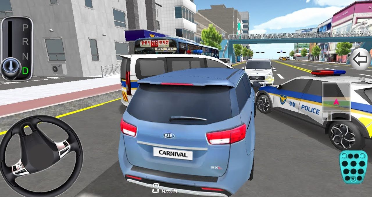 Blue Kia Carnival minivan stopped amid traffic with police car and city buildings visible