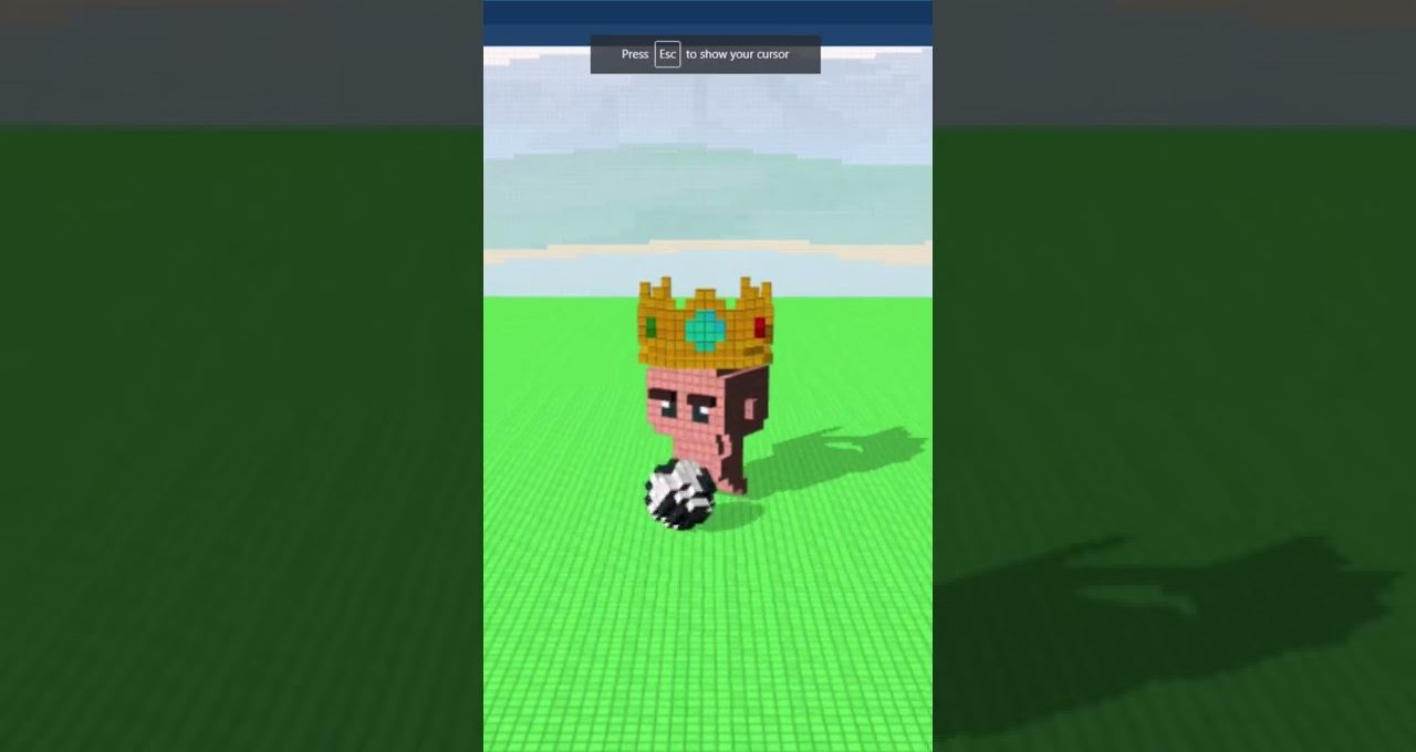 Voxel-style cartoon monkey wearing a jeweled crown standing on green grid with ball