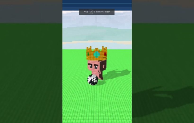 Voxel-style cartoon monkey wearing a jeweled crown standing on green grid with ball