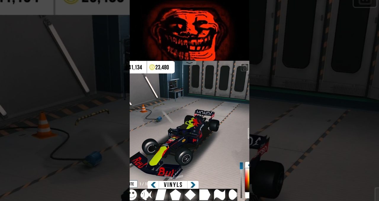 Racing garage scene showing a customized Red Bull-style Formula car with decals