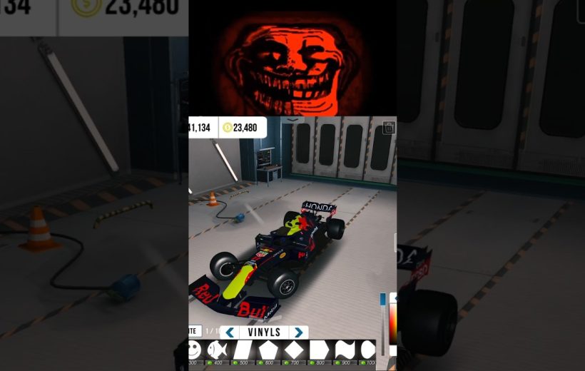Racing garage scene showing a customized Red Bull-style Formula car with decals
