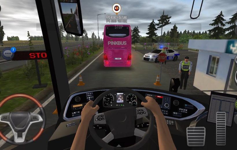 Driver view inside bus approaching pink coach at police roadside checkpoint with officer