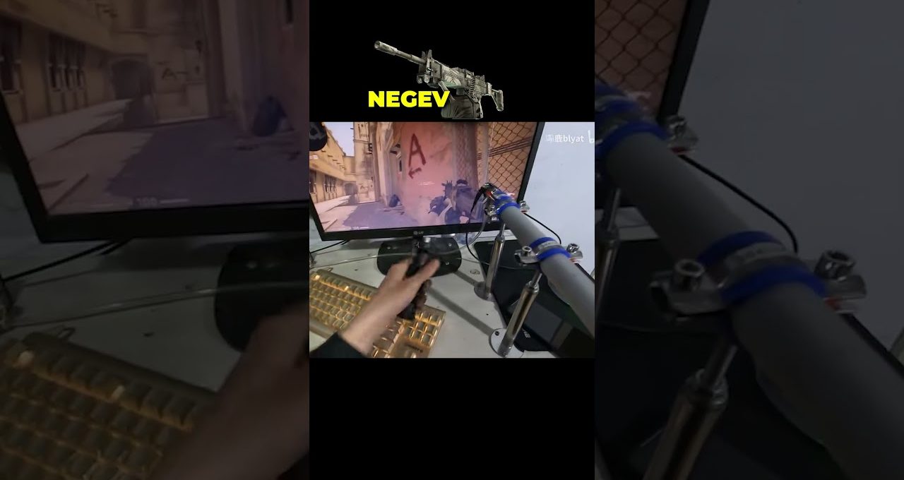 Person using a custom joystick rig to play a first-person shooter on monitor