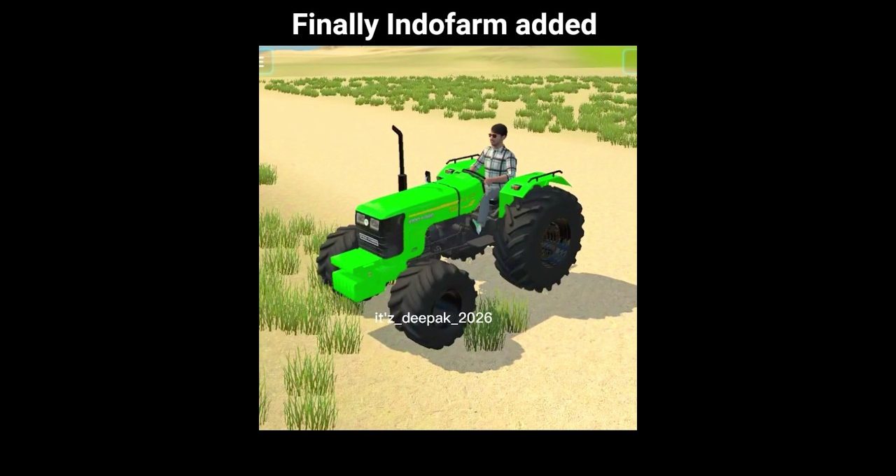 Bright green tractor driven by a man across a sandy field with sparse grass