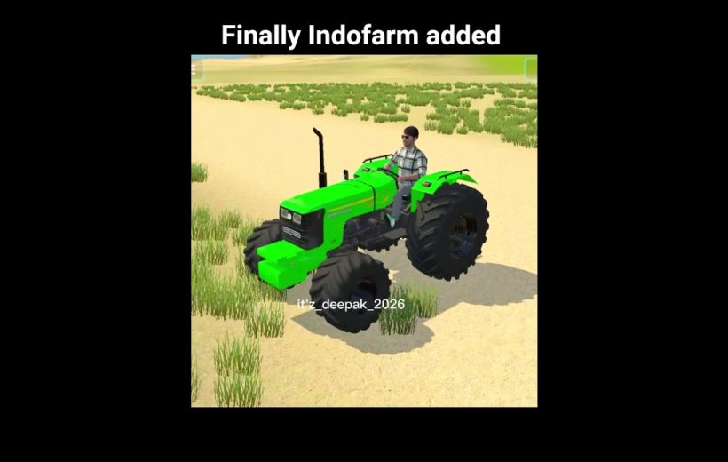 Bright green tractor driven by a man across a sandy field with sparse grass