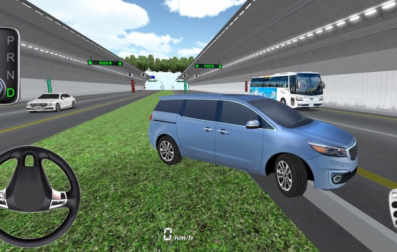 Blue minivan parked on grassy median beside multi-lane tunnel road with traffic controls