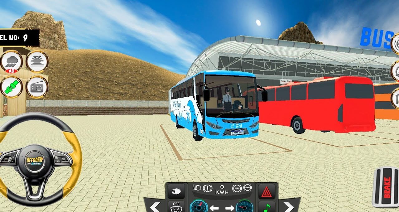 Blue coach bus parked beside a red bus at a modern bus terminal.