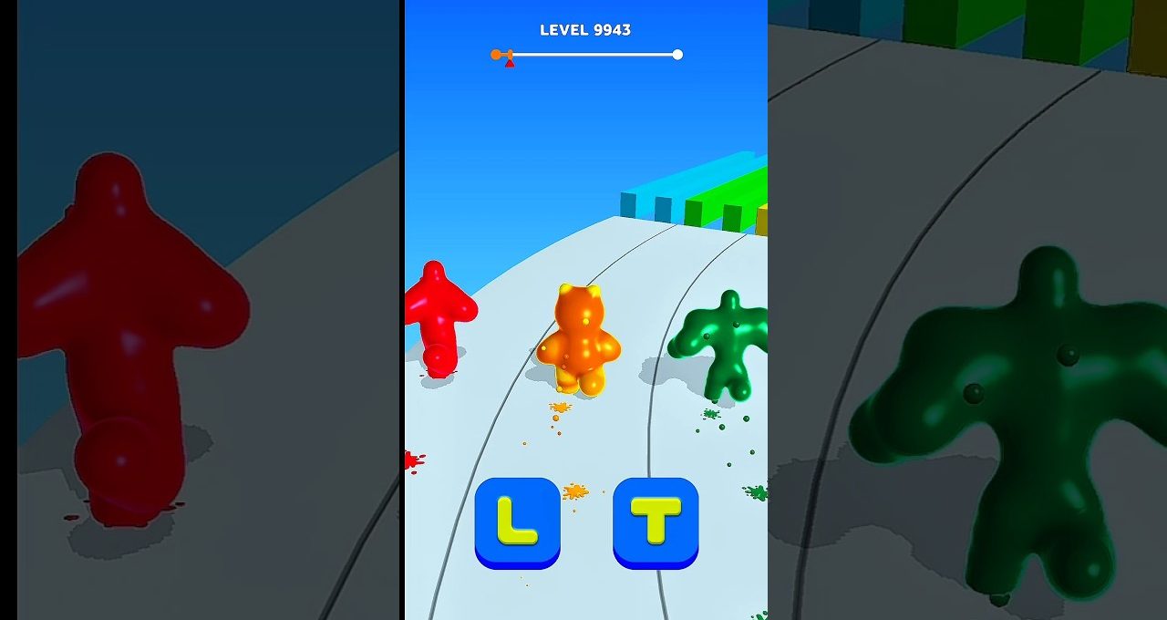 Three colorful gummy characters racing down a paint-splattered track in game level.