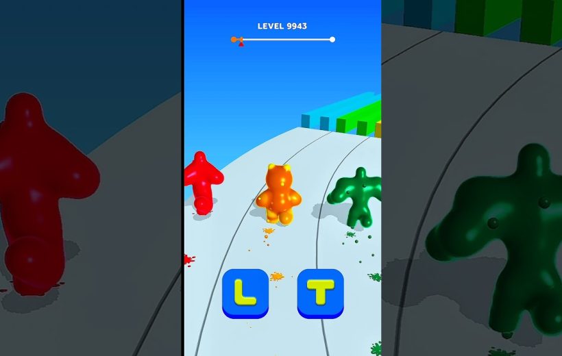 Three colorful gummy characters racing down a paint-splattered track in game level.