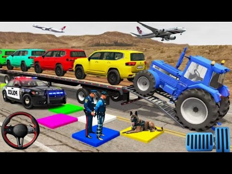 Colorful SUVs loaded on a trailer while a blue tractor, police officers, and dog stand nearby