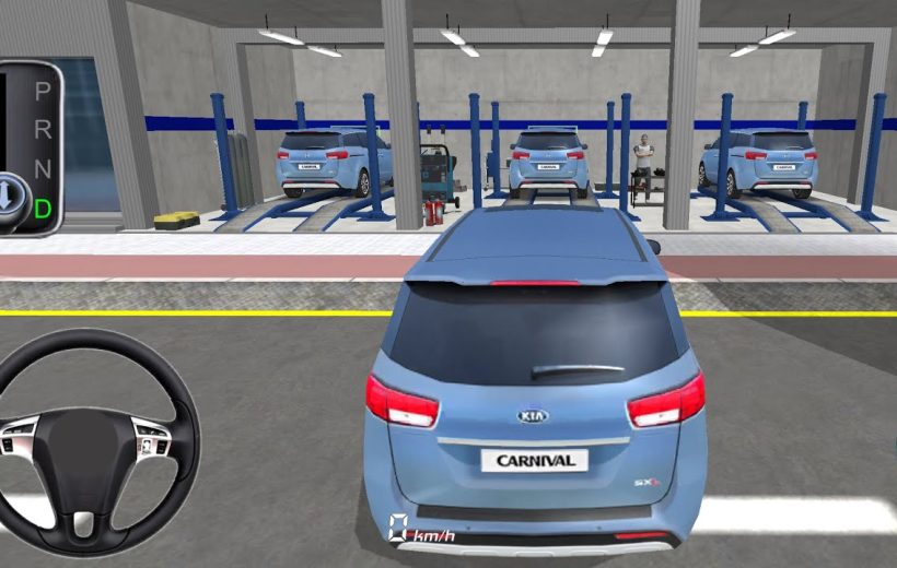 Blue Kia Carnival being parked outside a garage with multiple vehicles on lifts