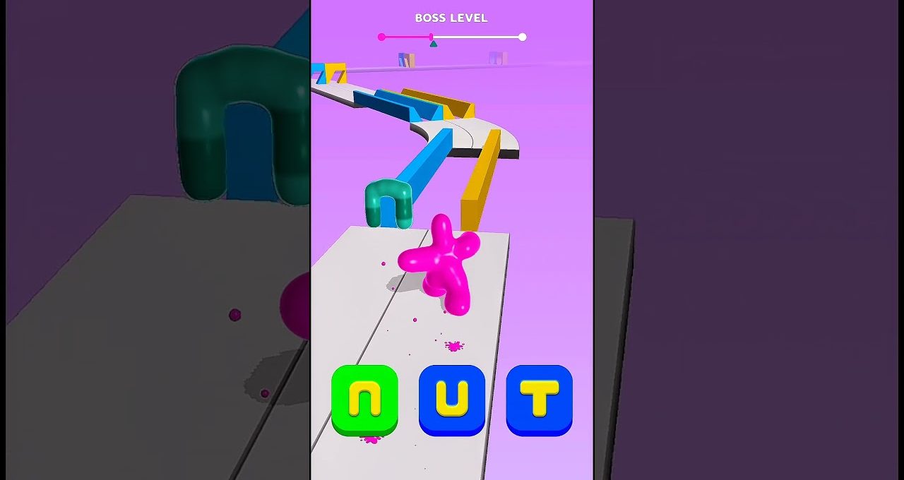 Colorful mobile game level showing a pink blob character navigating a winding platform.