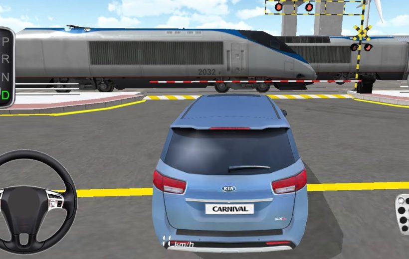 Blue Kia Carnival stopped at a railroad crossing as a train passes by.