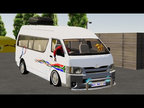 White minibus with South African flag stripes parked in an outdoor lot