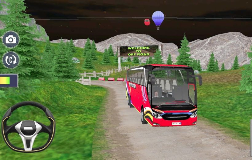 Red tour bus driving on a dirt mountain road under an "Welcome to Off Road" sign