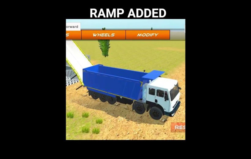 Blue dump truck parked beside a ramp in a grassy dirt field scene