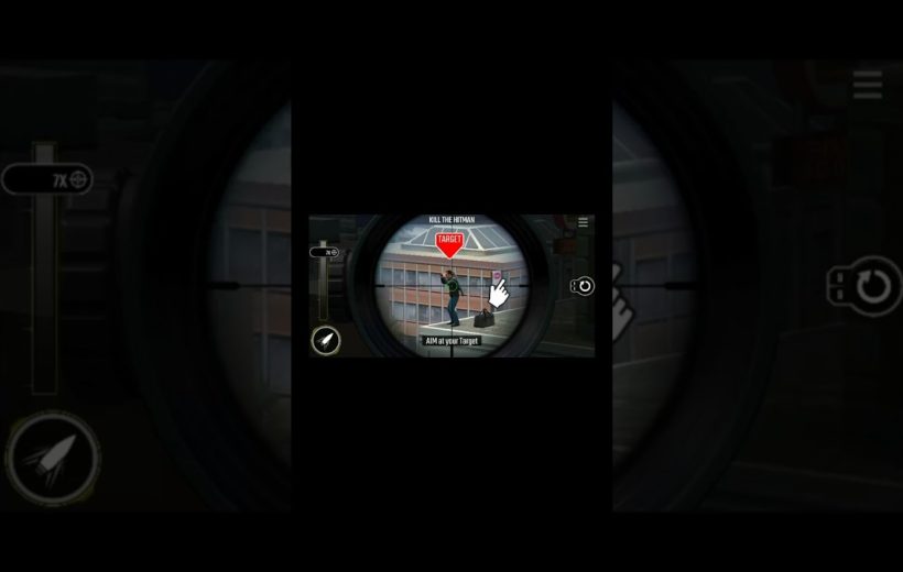 Sniper scope aimed at a rooftop target labeled "TARGET" with city buildings background