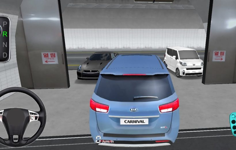 Blue Kia Carnival minivan parked inside a garage with two cars visible ahead