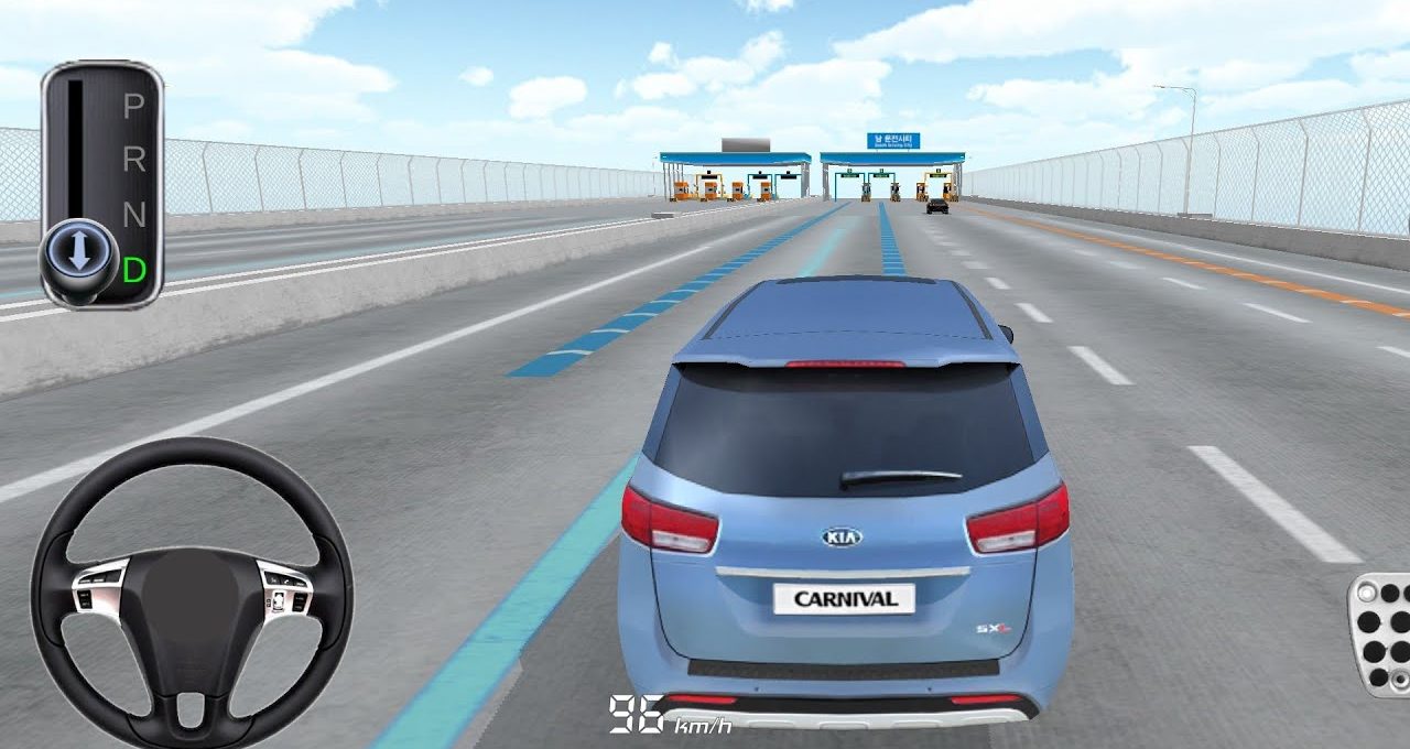 Blue Kia Carnival minivan driving toward toll booths on a multi-lane highway bridge.