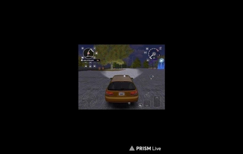 Yellow hatchback driving at night in a parking lot within a driving game HUD