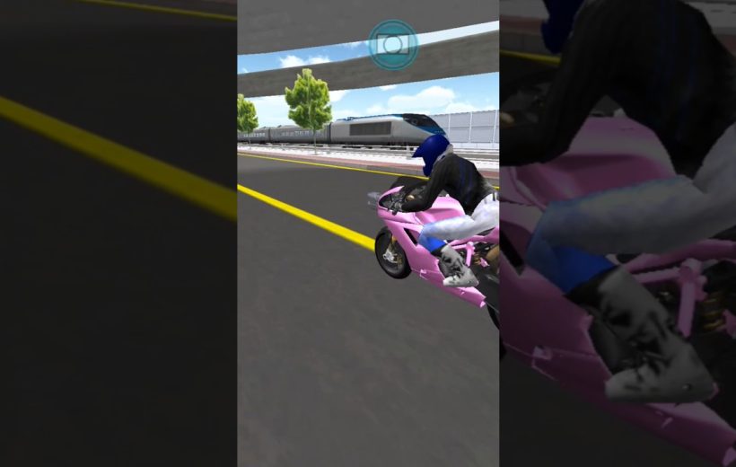 Person in blue helmet riding a pink sport motorcycle on a city road