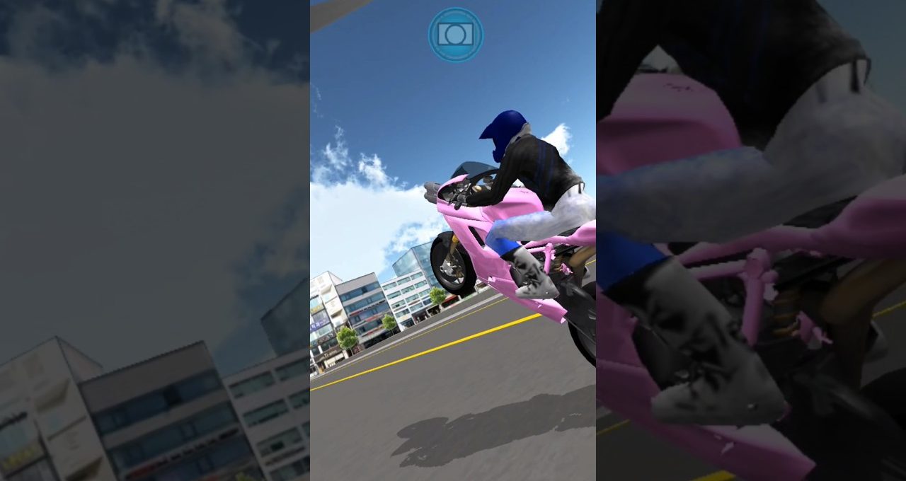 Rider in blue helmet performing a wheelie on a pink sport motorcycle downtown