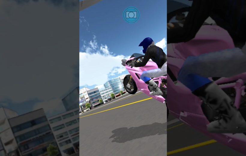 Motorcyclist in blue helmet performing a wheelie on a pink sportbike through city