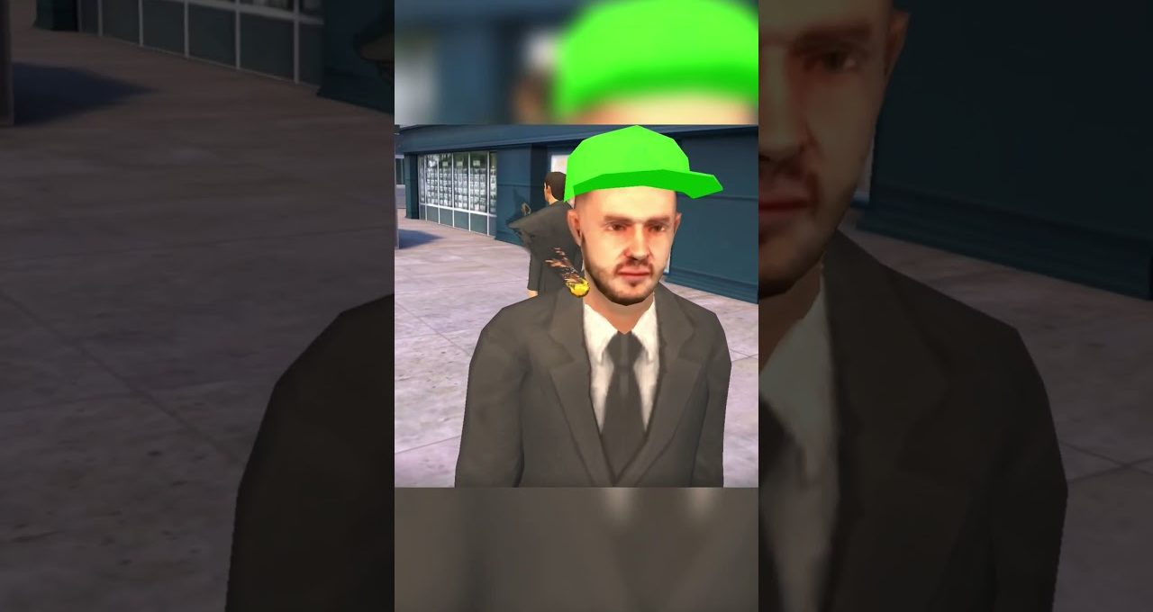 Man in a suit wearing a bright green baseball cap standing outdoors by buildings