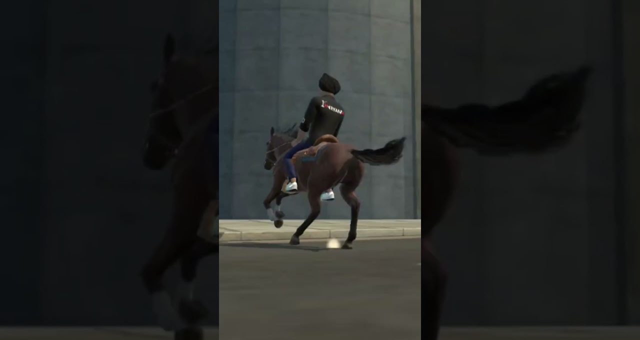 Person wearing jacket riding a brown horse at speed on a city street