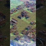 Small medieval Asian village with rice paddies, wooden houses, and a central pavilion.