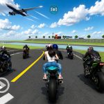 Group of motorcyclists racing on a track with an airplane flying overhead.