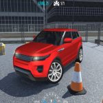 Red SUV parked in a fenced training lot with traffic cones and steering wheel controls