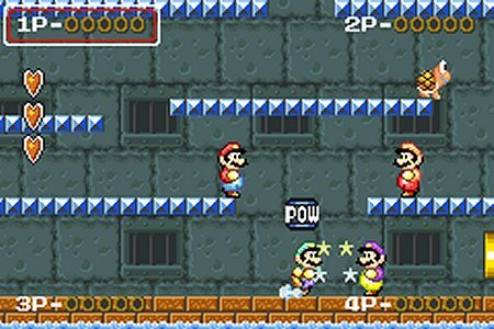 Two pixelated Mario characters and enemies on multi-level blue brick platformer stage